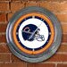 Chicago Bears NFL Team Helmet Neon Lamp Wall Clock 15 in. Diameter - Classic Neon Light w/Chrome Accents Ready to Spruce Up Any Home Den, Office, Bar, Dorm Room, or Game Room - NFL-CBE-276